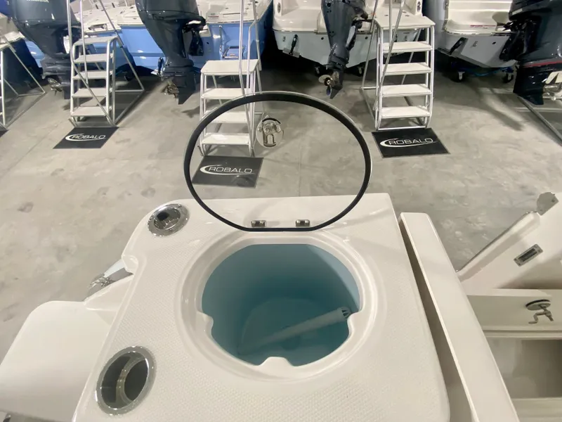Slide: The Image of 2024 Robalo R250 boat livewell in showroom. - 12
