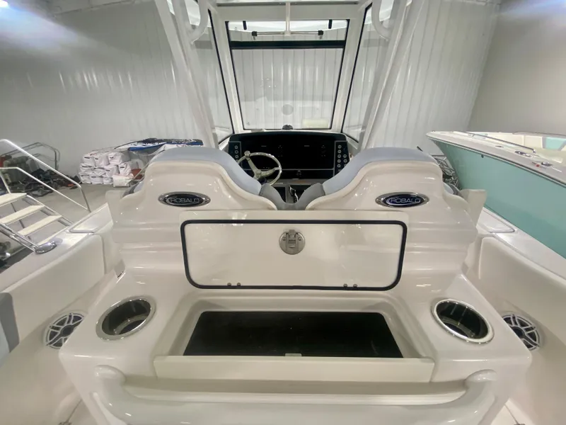 Slide: The Image of 2024 Robalo R250 boat interior with dual seats and steering console. - 17