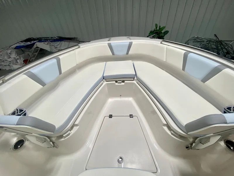 Slide: The Image of 2024 Robalo R250 boat interior with white and gray seating. - 31