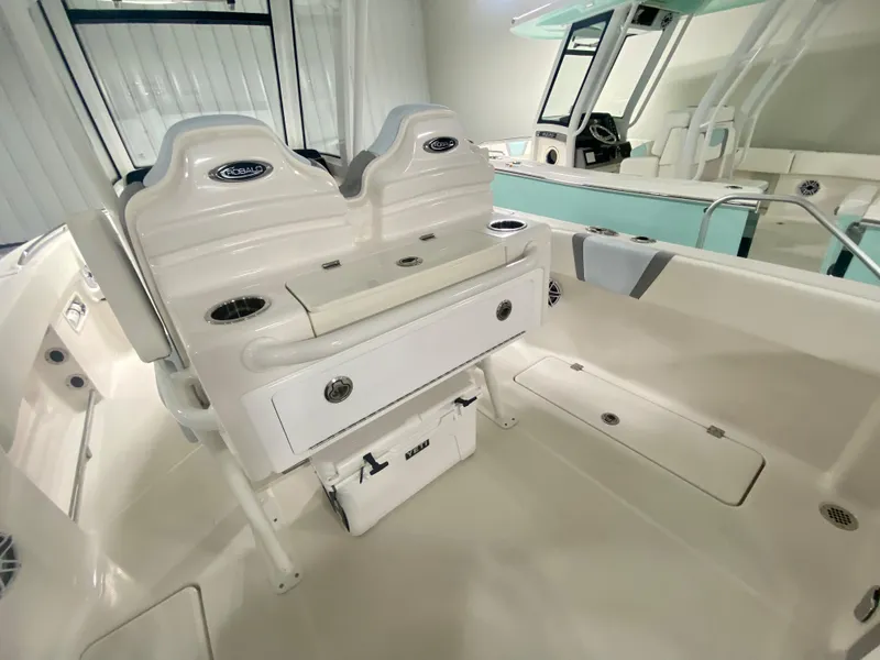 Slide: The Image of 2024 Robalo R250 boat interior with seating and storage compartments. - 14