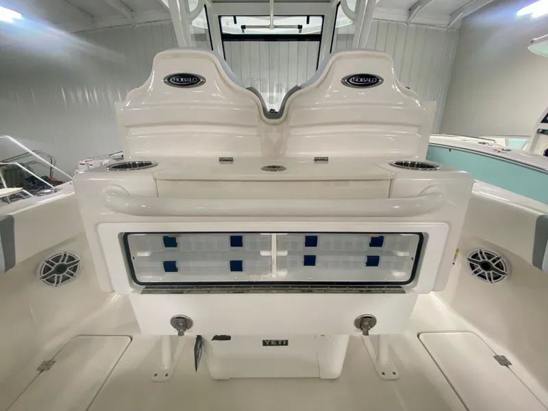 Slide: The Image of 2024 Robalo R250 boat interior, featuring a spacious deck and modern amenities. - 16