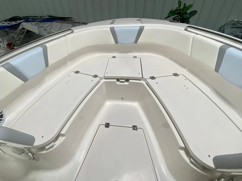 Slide: The Image of 2024 Robalo R250 boat interior with spacious seating and storage compartments. - 30