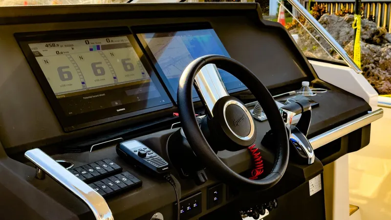 Slide: The Image of 2022 Windy SR44 SX boat dashboard with steering wheel and digital displays. - 13