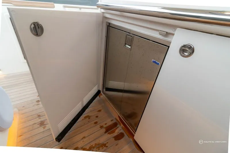 Slide: The Image of Open storage compartment on 2022 Windy SR44 SX yacht with stainless steel interior. - 28