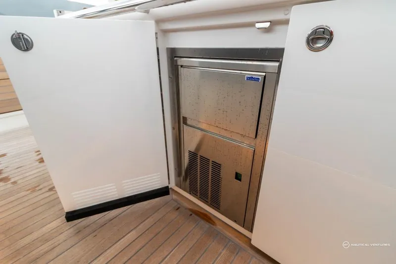 Slide: The Image of Built-in refrigerator on the 2022 Windy SR44 SX yacht. - 30