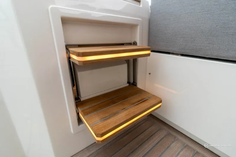 Slide: The Image of Folding wooden steps with LED lighting on a 2022 Windy SR44 SX boat. - 32