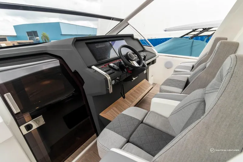 Slide: The Image of Interior cockpit of 2022 Windy SR44 SX boat with modern steering and seating. - 35