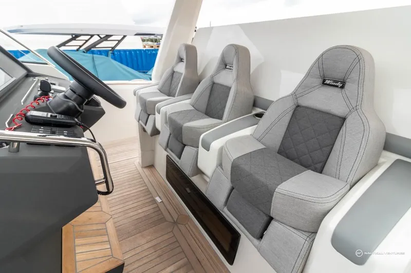 Slide: The Image of 2022 Windy SR44 SX boat cockpit with three grey cushioned seats. - 37