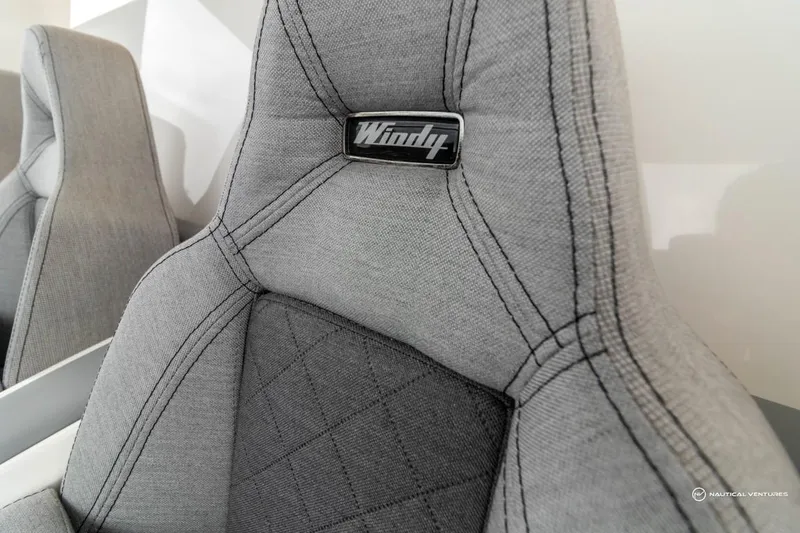 Slide: The Image of Close-up of 2022 Windy SR44 SX boat seat with grey upholstery and logo. - 38
