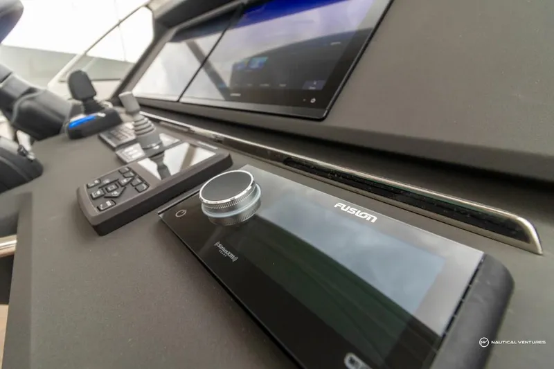 Slide: The Image of Control panel of 2022 Windy SR44 SX yacht with advanced navigation and audio systems. - 43