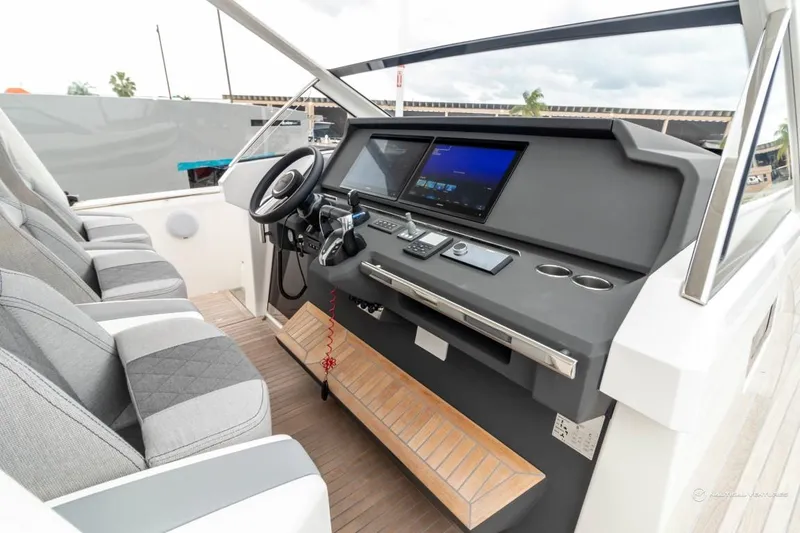 Slide: The Image of 2022 Windy SR44 SX boat cockpit with modern navigation system and comfortable seating. - 44