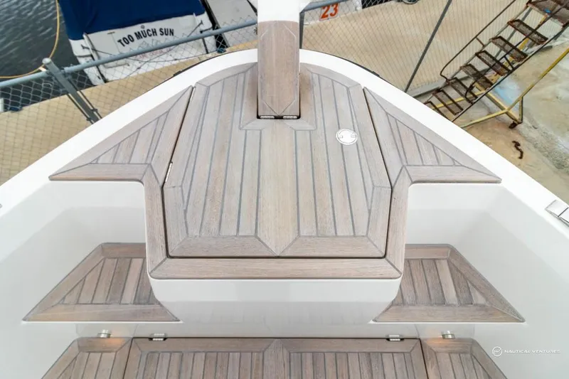 Slide: The Image of Windy SR44 SX 2022 boat deck with wooden flooring and marina background. - 48