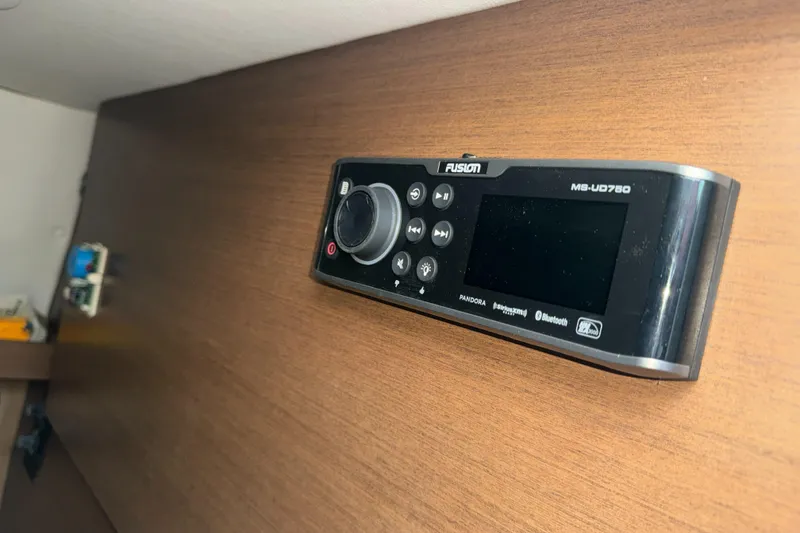 Slide: The Image of Fusion marine stereo system on 2015 Sea Ray 350 SLX boat interior. - 49