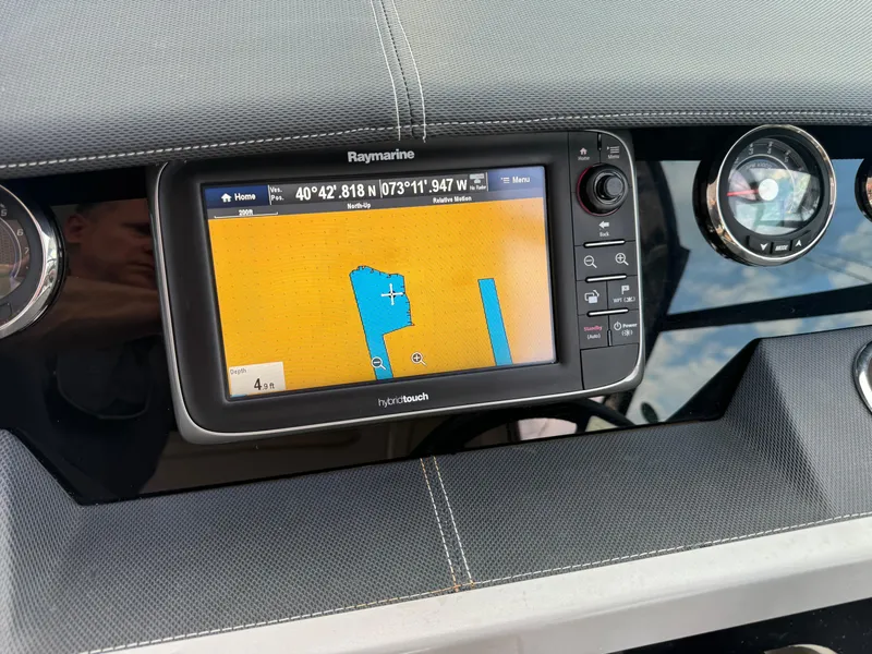 Slide: The Image of Raymarine navigation system on 2015 Sea Ray 350 SLX boat dashboard. - 46