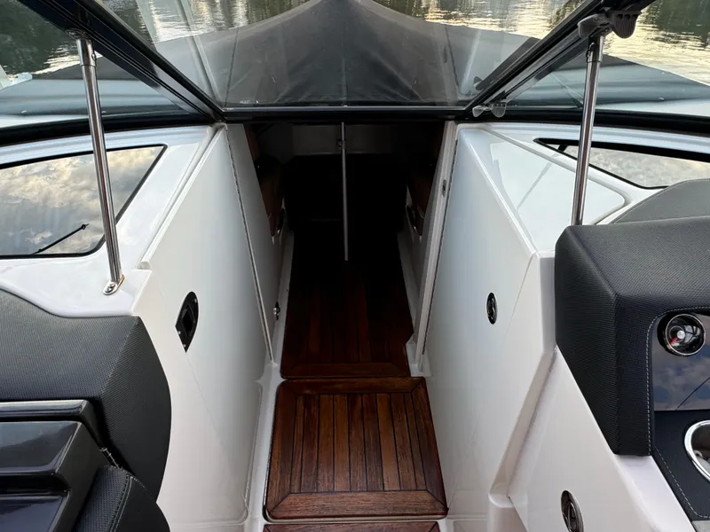 Slide: The Image of 2015 Sea Ray 350 SLX boat interior with wood flooring and sleek design. - 37