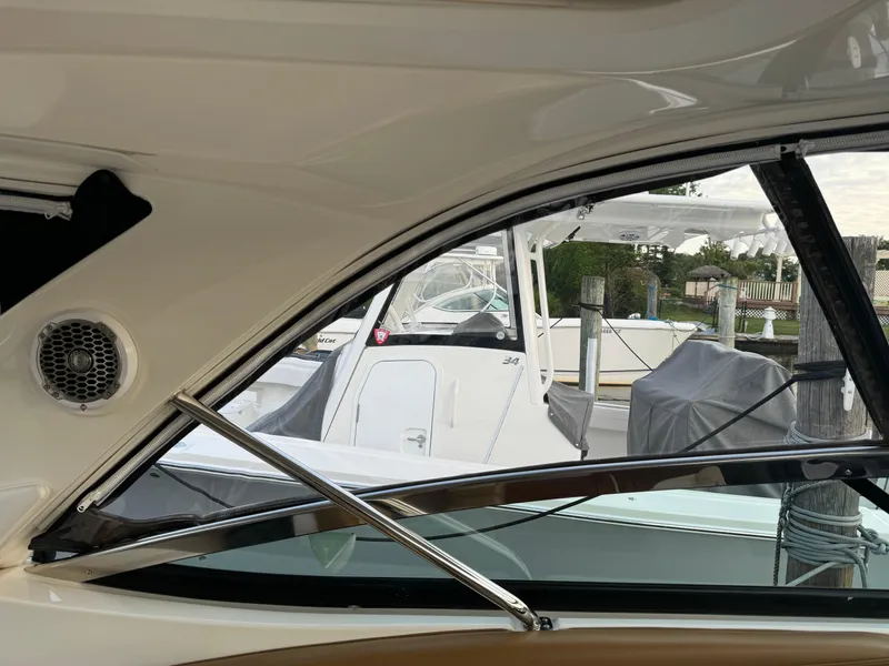 Slide: The Image of View from inside a 2015 Sea Ray 350 SLX boat at a marina. - 23