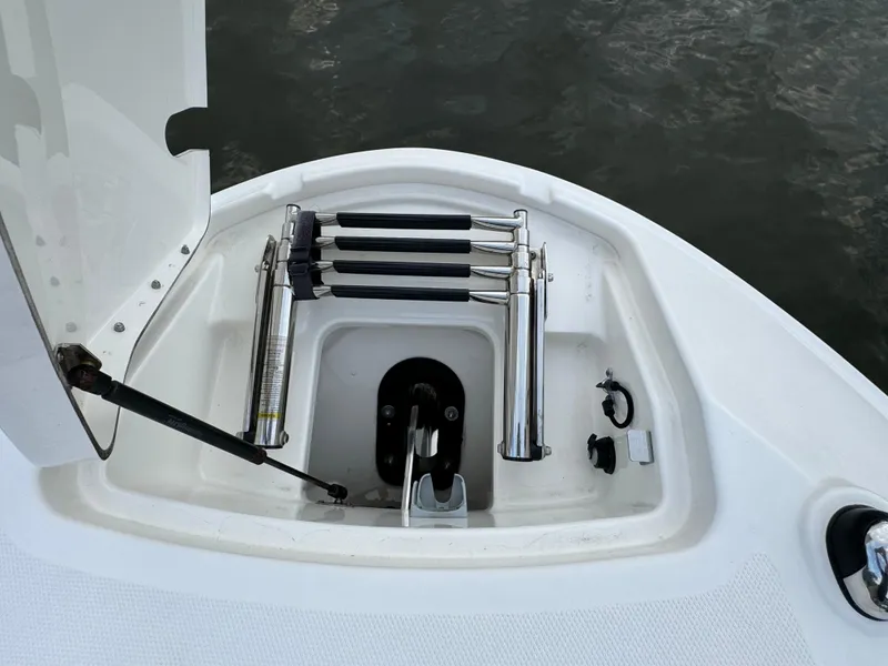 Slide: The Image of 2015 Sea Ray 350 SLX boat ladder compartment with stainless steel fittings. - 32
