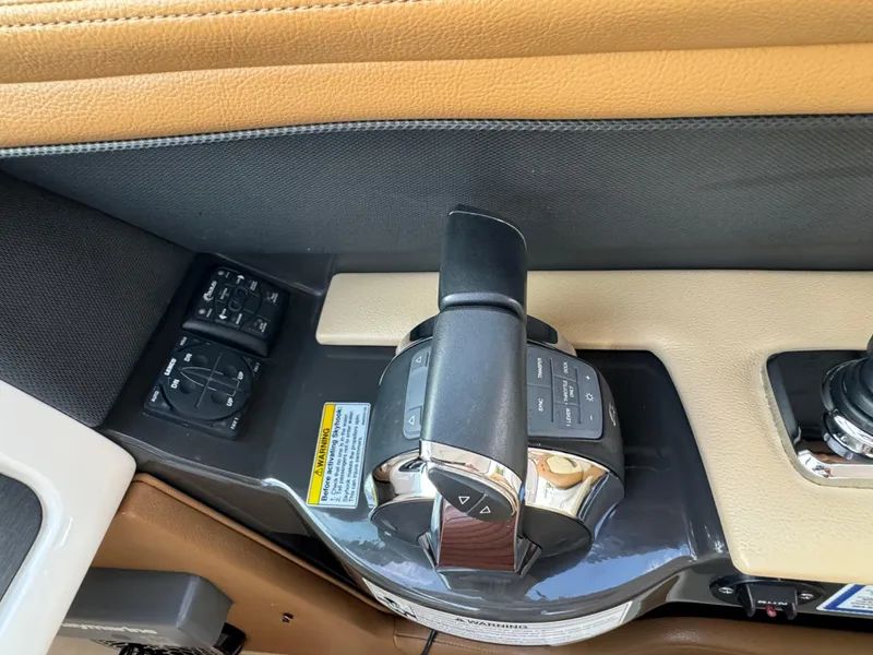 Slide: The Image of 2015 Sea Ray 350 SLX boat throttle controls and dashboard detail. - 44