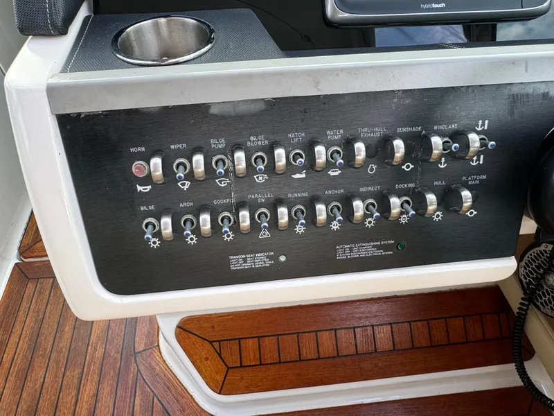 Slide: The Image of Control panel of a 2015 Sea Ray 350 SLX boat with various switches and buttons. - 40