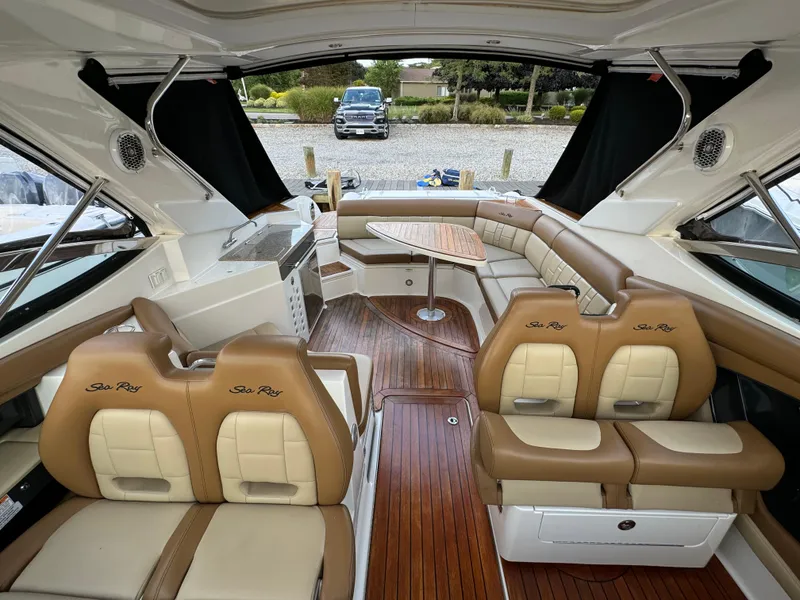 Slide: The Image of Luxurious 2015 Sea Ray 350 SLX boat interior with leather seating and wood flooring. - 19
