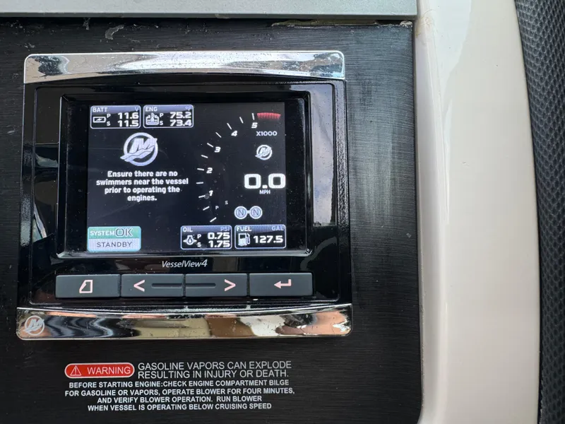 Slide: The Image of Control panel of a 2015 Sea Ray 350 SLX boat with safety warning. - 41