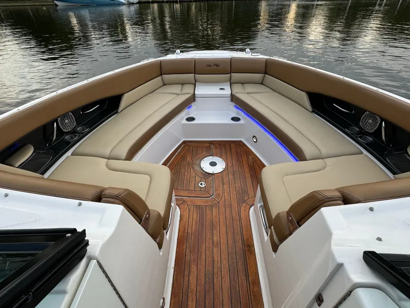 Slide: The Image of Luxurious 2015 Sea Ray 350 SLX boat interior with plush seating and wood flooring. - 27