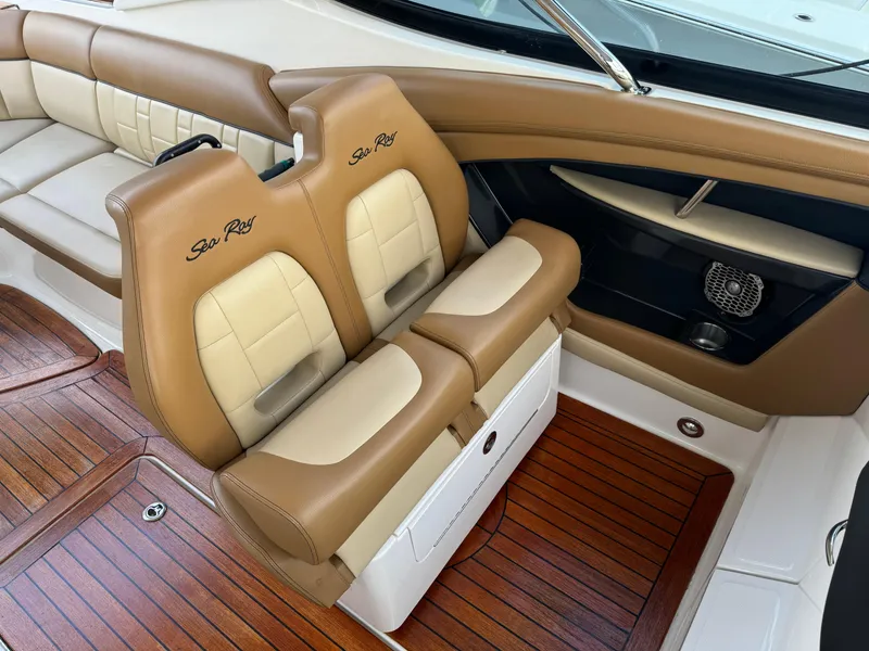 Slide: The Image of Luxurious interior of 2015 Sea Ray 350 SLX with tan leather seating and wood flooring. - 18