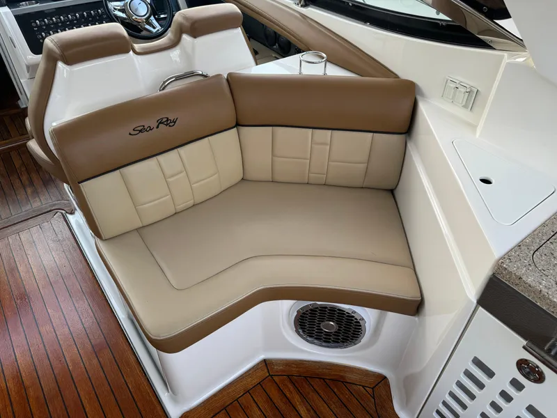 Slide: The Image of Luxurious seating on 2015 Sea Ray 350 SLX boat with tan and cream upholstery. - 15
