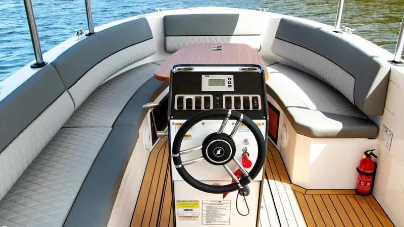 Slide: The Image of 2023 Alfastreet 21 Open boat interior with steering wheel and seating. - 12