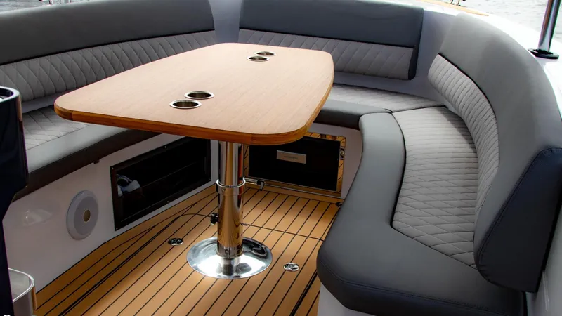 Slide: The Image of Interior of 2023 Alfastreet 21 Open boat with wooden table and cushioned seating. - 29