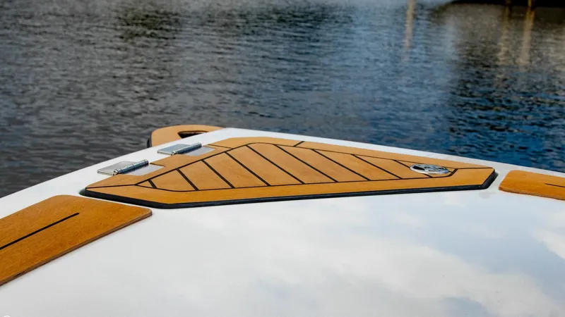 Slide: The Image of 2023 Alfastreet 21 Open boat deck with wooden accents on water. - 7