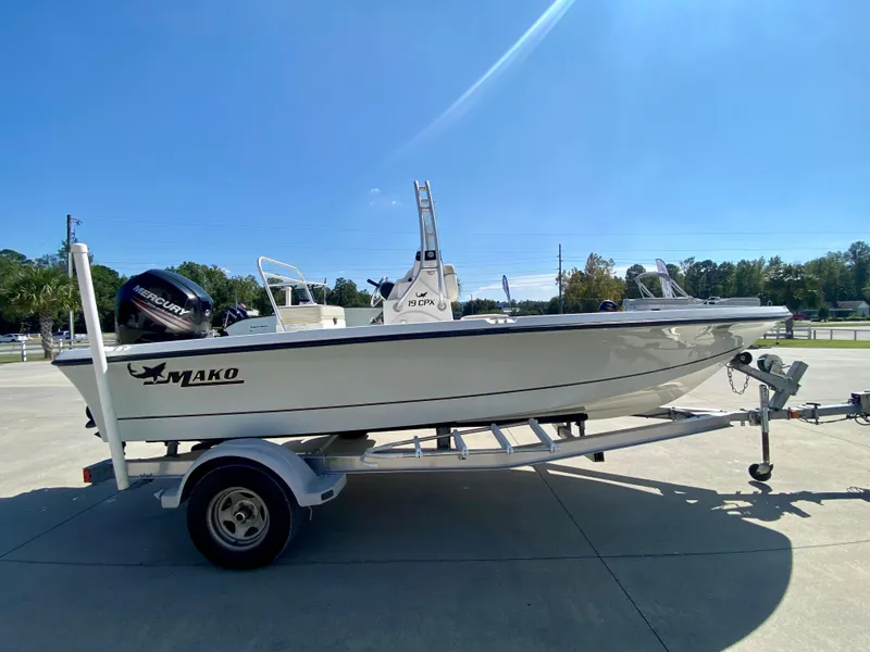 Slide: The Image of 2017 Mako 19 CPX boat on trailer with Mercury outboard motor. - 1