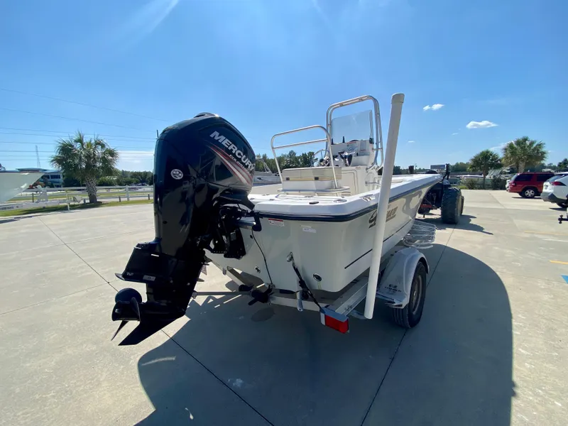 Slide: The Image of 2017 Mako 19 CPX boat with Mercury outboard motor on trailer. - 3