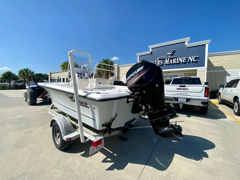 Slide: The Image of 2017 Mako 19 CPX boat with Mercury engine at a dealership. - 4