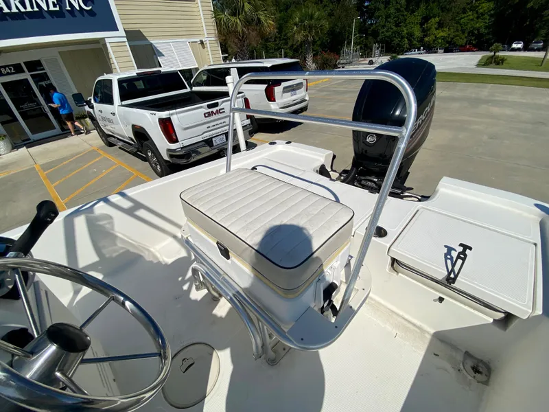 Slide: The Image of 2017 Mako 19 CPX boat interior with steering wheel and seating. - 7