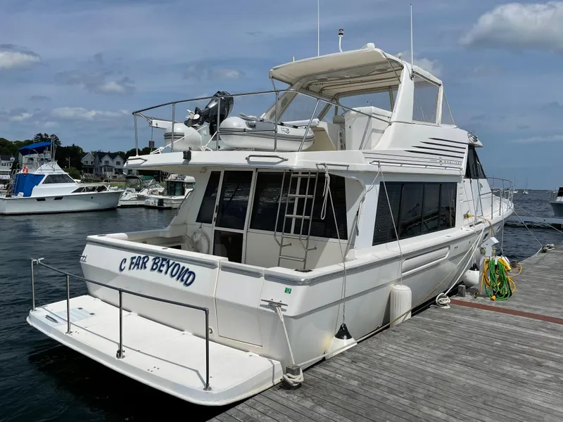 Slide: The Image of 1998 Bayliner 4788 Pilot House Motoryacht docked at marina. - 10