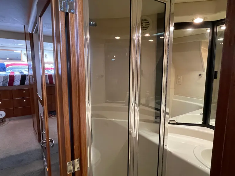 Slide: The Image of 1998 Bayliner 4788 Pilot House Motoryacht interior with shower and bedroom view. - 26