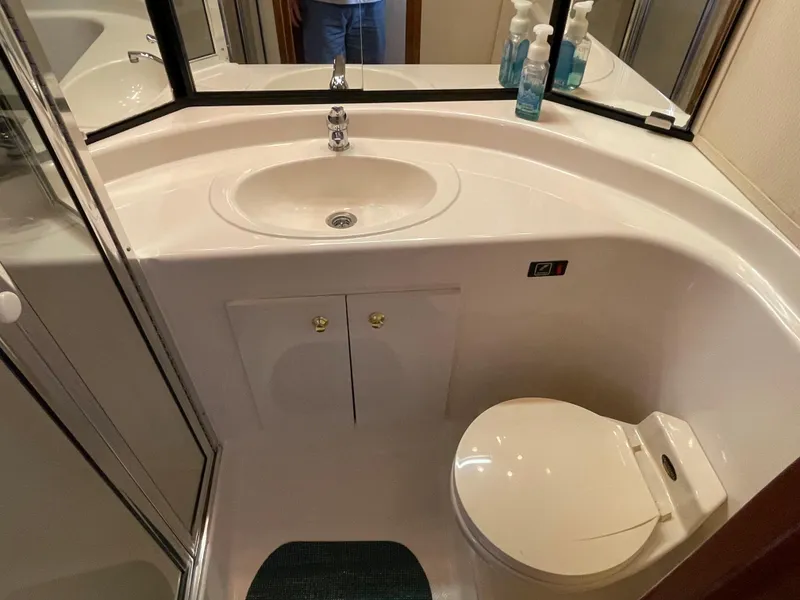 Slide: The Image of 1998 Bayliner 4788 Pilot House Motoryacht bathroom with sink and toilet. - 28