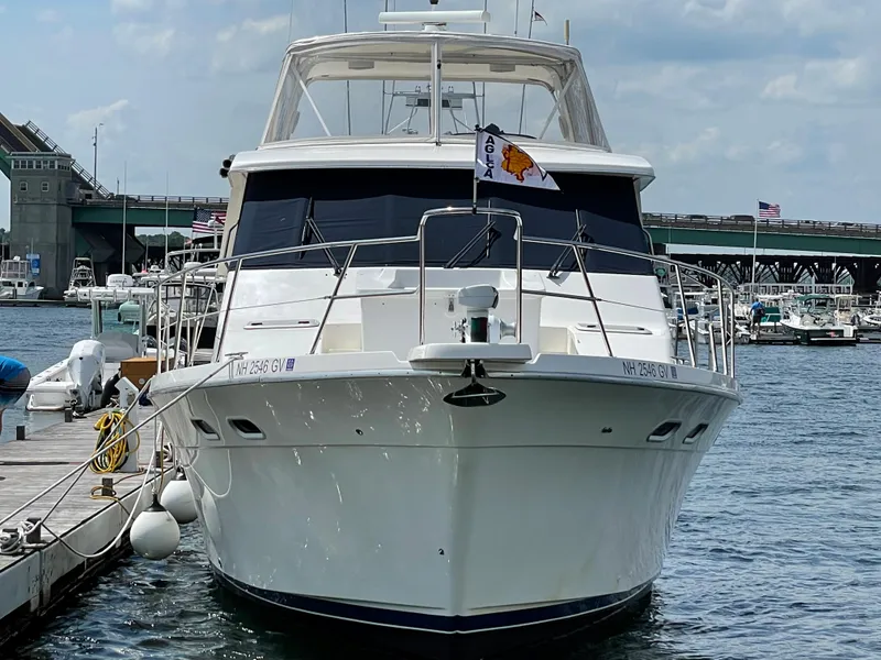 Slide: The Image of 1998 Bayliner 4788 Pilot House Motoryacht docked at a marina. - 3