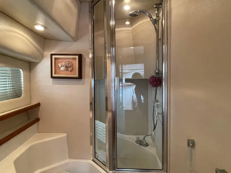 Slide: The Image of 1998 Bayliner 4788 Pilot House Motoryacht bathroom with shower and framed artwork. - 37