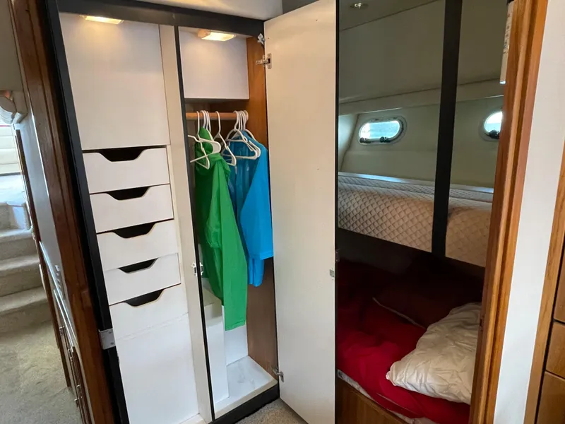 Slide: The Image of 1998 Bayliner 4788 Pilot House Motoryacht interior with closet and bunk beds. - 39