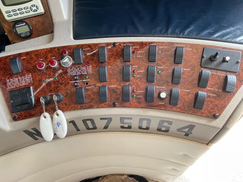 Slide: The Image of Control panel of a 1998 Bayliner 4788 Pilot House Motoryacht with keys and switches. - 46