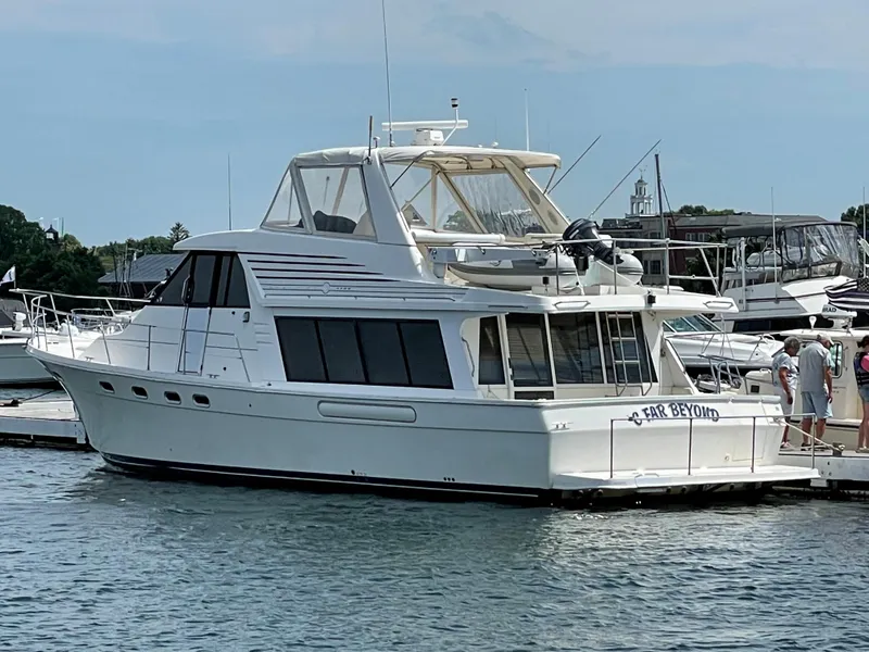Slide: The Image of 1998 Bayliner 4788 Pilot House Motoryacht docked at a marina. - 8