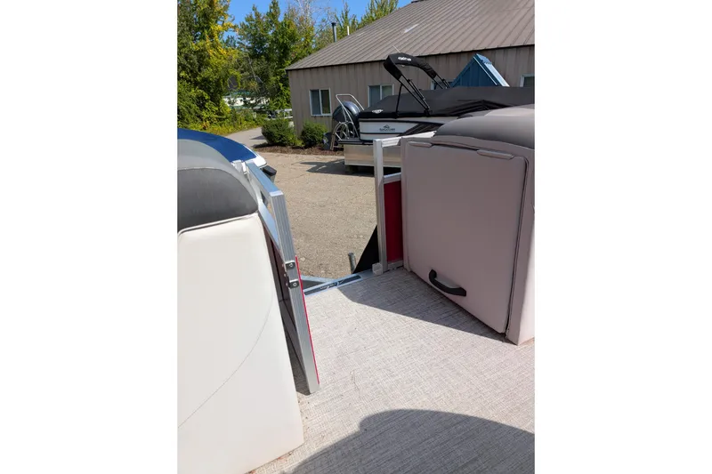 Slide: The Image of 2023 Avalon VENTURE CRUISE boat interior with open gate, showing seating and outdoor view. - 10