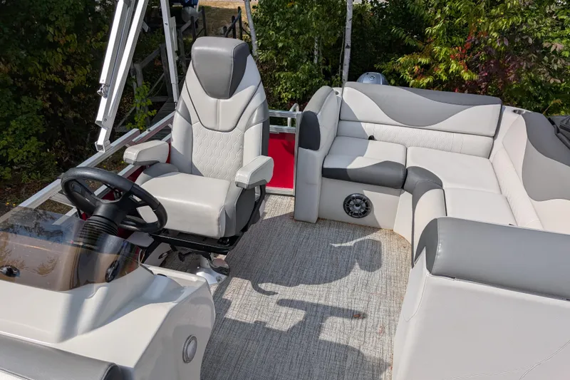 Slide: The Image of 2023 Avalon VENTURE CRUISE boat interior with plush seating and steering console. - 5