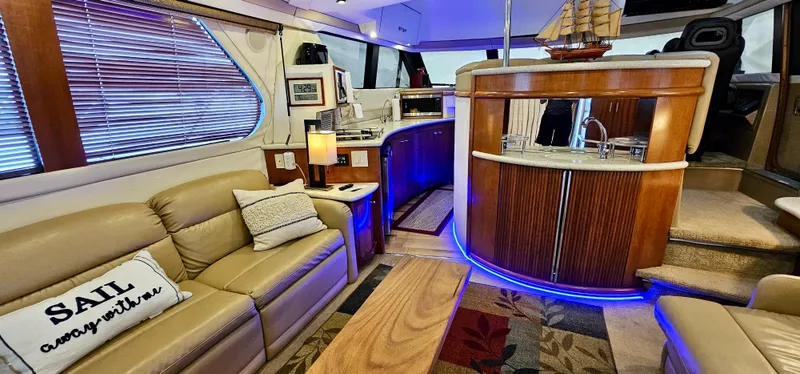 Slide: The Image of Luxurious interior of a 1999 Carver 450 Pilothouse yacht with modern amenities. - 23