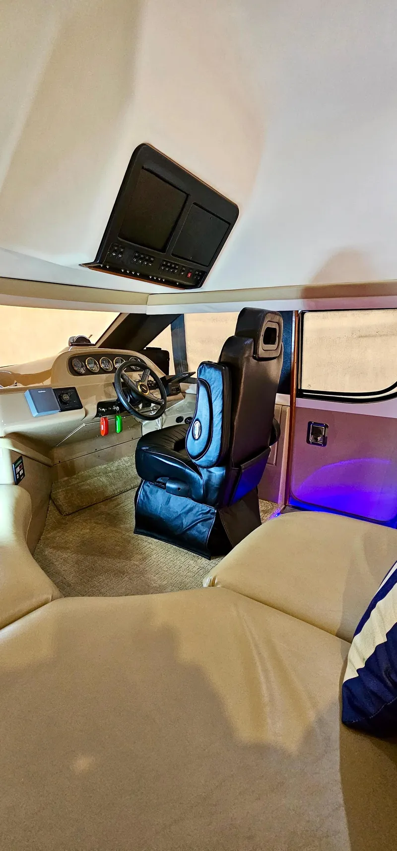 Slide: The Image of Interior of a 1999 Carver 450 Pilothouse yacht with captain's chair and control panel. - 26