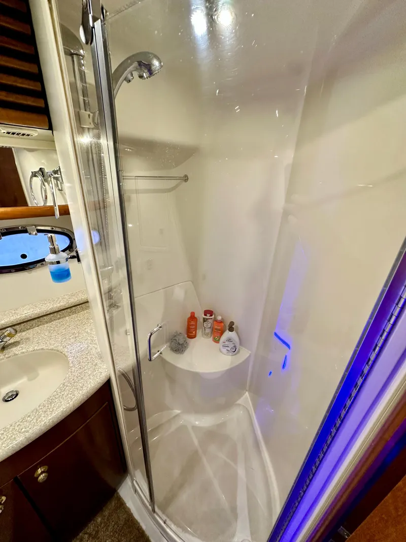 Slide: The Image of 1999 Carver 450 Pilothouse yacht bathroom with shower and sink. - 47