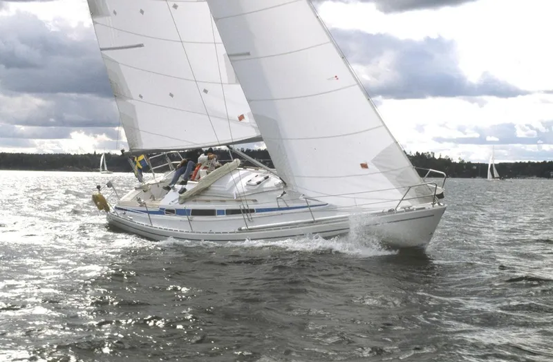 Slide: The Image of Arcona 355 Sloop 2002 sailing on open water under cloudy skies. - 1