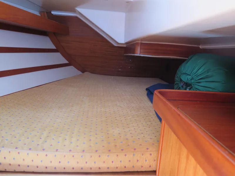 Slide: The Image of Interior cabin of a 2002 Arcona 355 Sloop with a cozy sleeping area. - 21